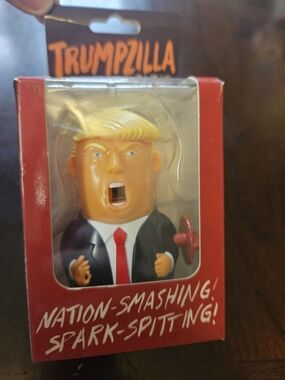 Novelty Orange and Black Figure Toy - Trumpzilla Spark-Spitting Wind Up Toy